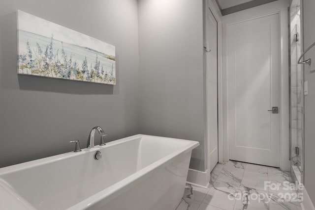 bathroom with a tub to relax in