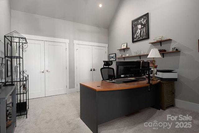 carpeted office with high vaulted ceiling