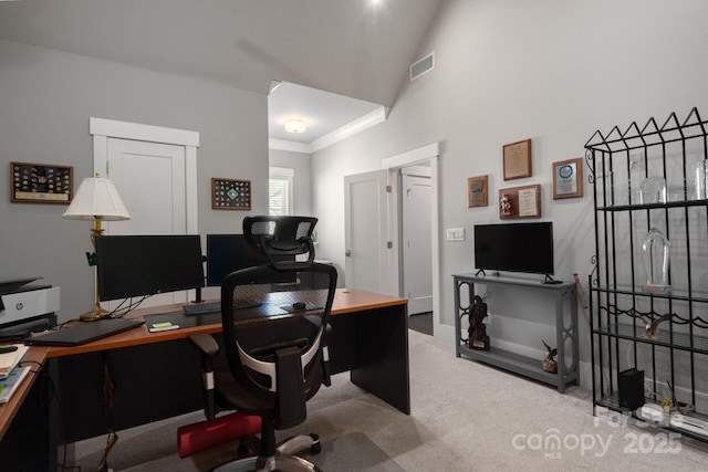 carpeted office featuring vaulted ceiling