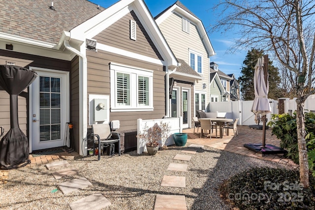 back of property with a patio area