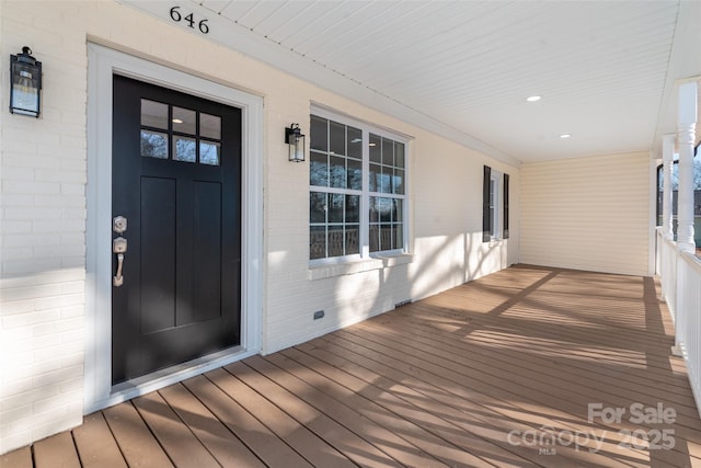 doorway to property featuring a porch