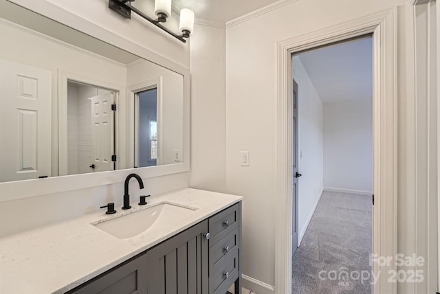 bathroom featuring vanity and ornamental molding