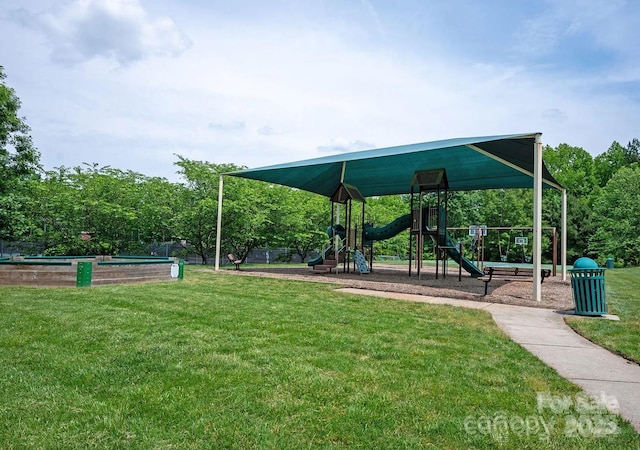 view of home's community featuring a playground and a yard