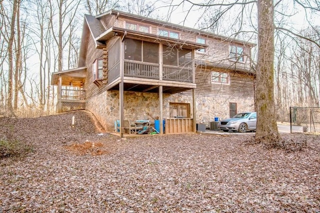 rear view of house with a sunroom