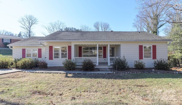 ranch-style home with a porch and a front lawn