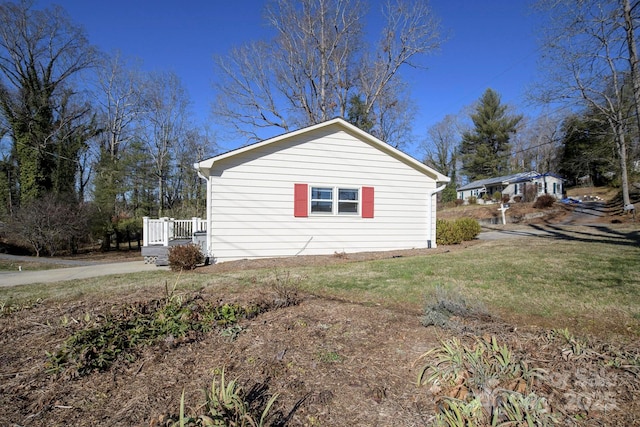 view of home's exterior featuring a yard