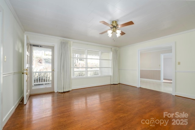 spare room featuring ceiling fan, crown molding, and hardwood / wood-style floors