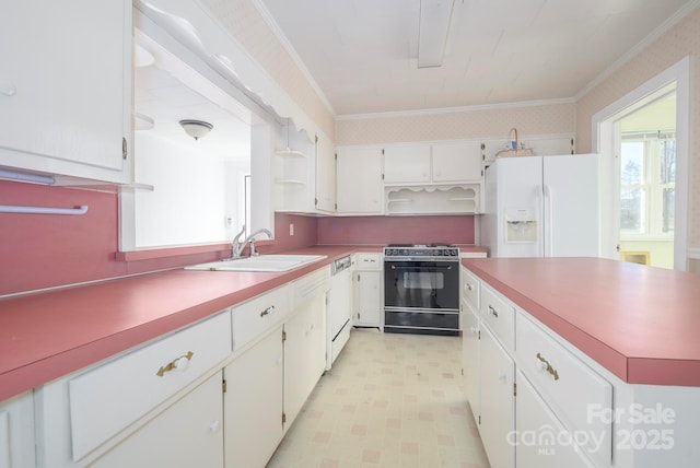 kitchen with white appliances, white cabinets, ornamental molding, and sink