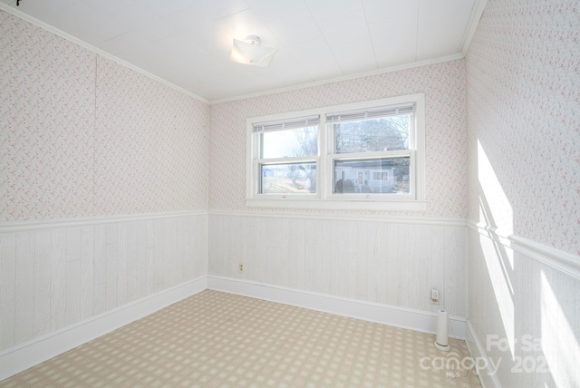 unfurnished room featuring ornamental molding