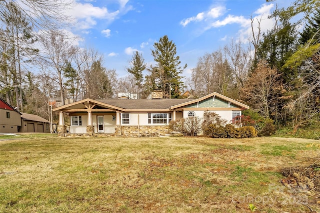 view of front of home featuring a front yard and covered porch