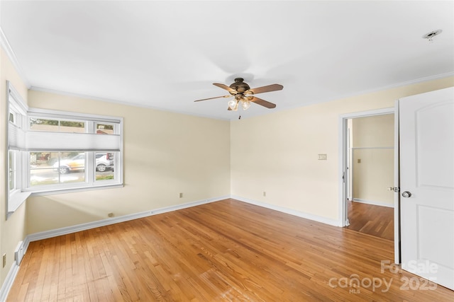 empty room featuring ornamental molding, ceiling fan, and light hardwood / wood-style flooring