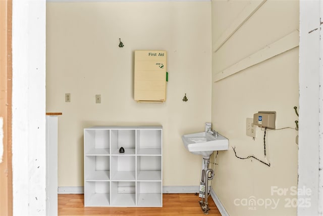 bathroom featuring sink and wood-type flooring