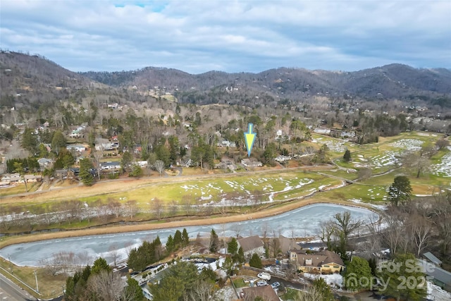 birds eye view of property featuring a water and mountain view