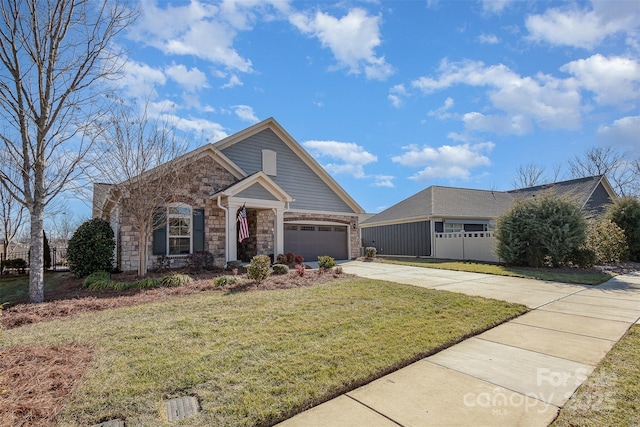 view of front of house featuring a front lawn and a garage