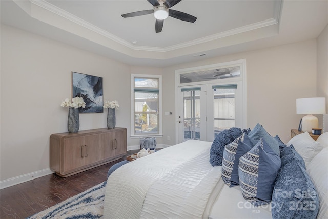 bedroom with dark wood-type flooring, access to outside, ornamental molding, a raised ceiling, and ceiling fan