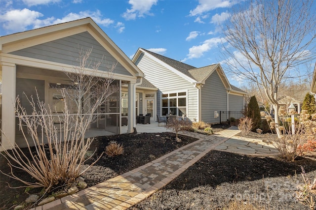 back of house with a patio