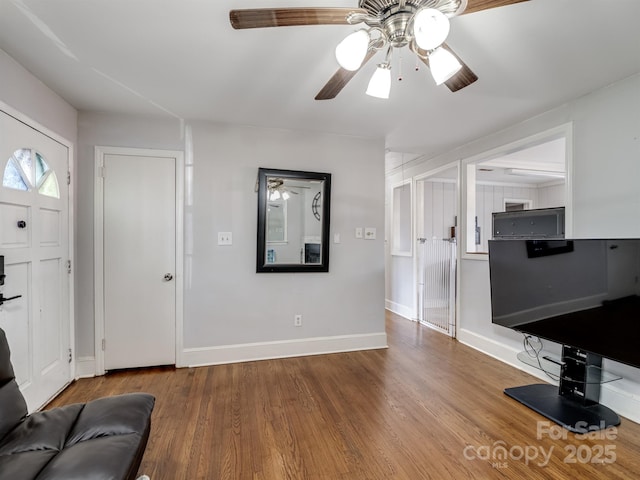 entrance foyer featuring ceiling fan and wood-type flooring