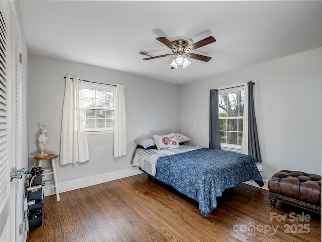 bedroom with ceiling fan and hardwood / wood-style flooring