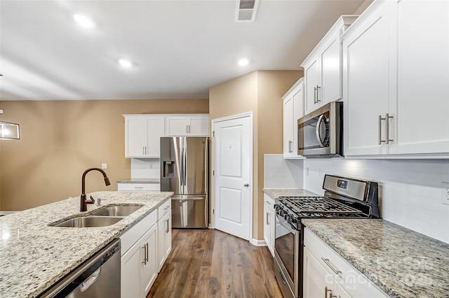 kitchen with white cabinets, sink, and stainless steel appliances