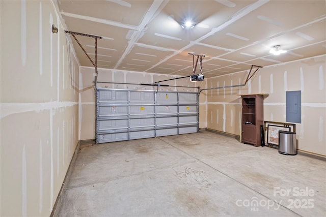 garage featuring a garage door opener and electric panel