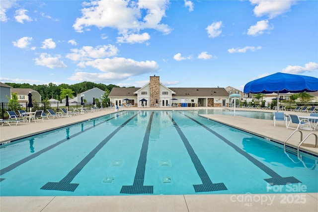 view of swimming pool featuring a patio area