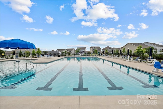 view of swimming pool with a patio