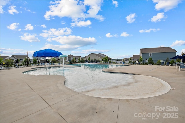 view of swimming pool featuring a patio area