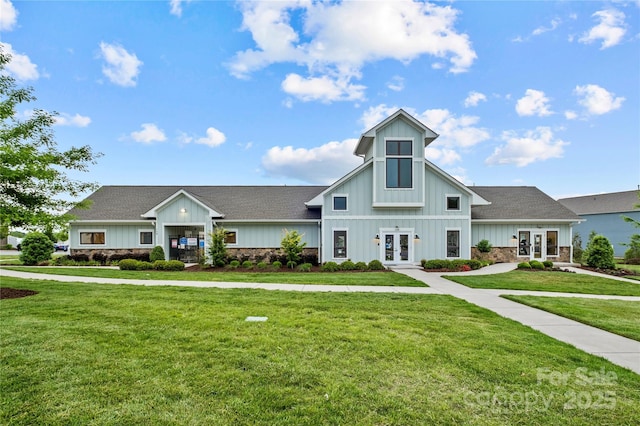 view of front of home with french doors and a front yard