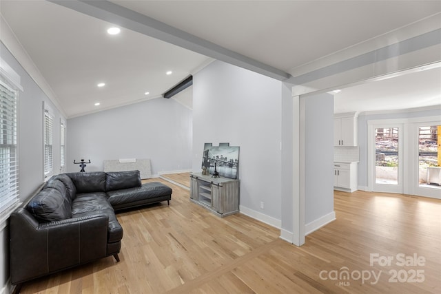 living room with crown molding, lofted ceiling with beams, and light wood-type flooring