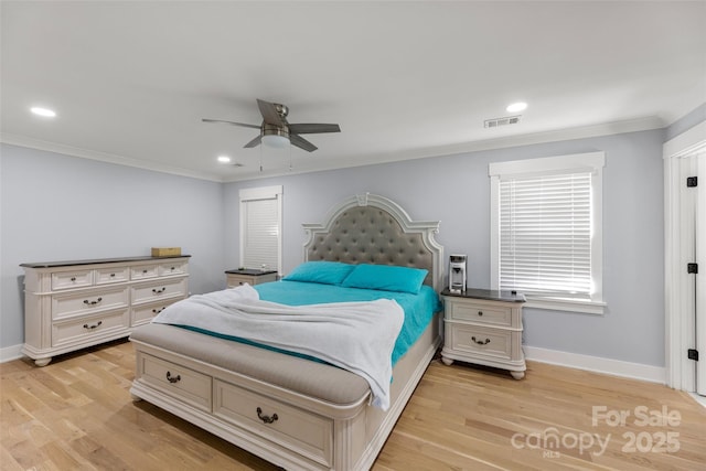 bedroom with ceiling fan, light wood-type flooring, and ornamental molding