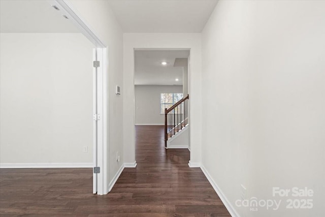 hallway featuring dark hardwood / wood-style flooring