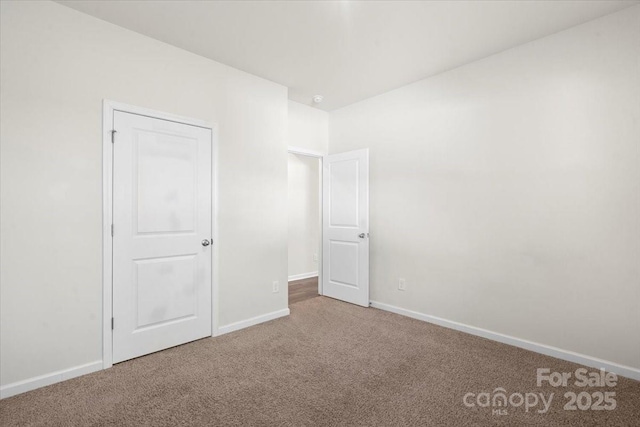 unfurnished bedroom with carpet flooring