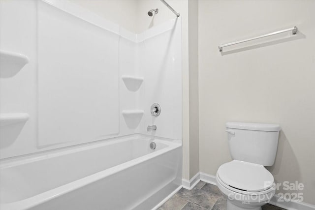 bathroom with toilet and bathtub / shower combination