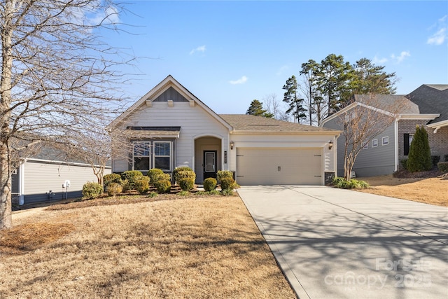 view of front of property with a front yard and a garage