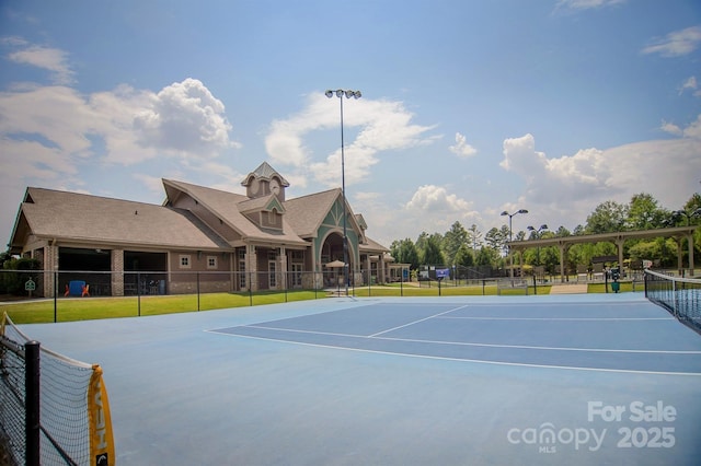 view of sport court with basketball hoop