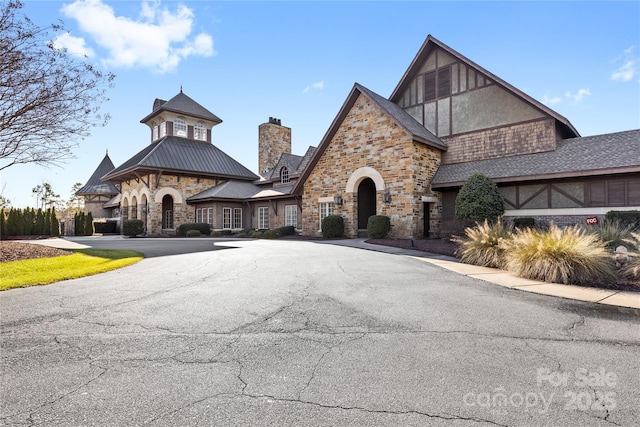 9307 Dufaux Dr, Charlotte, NC 28278 - view of front facade with a chimney and stone siding