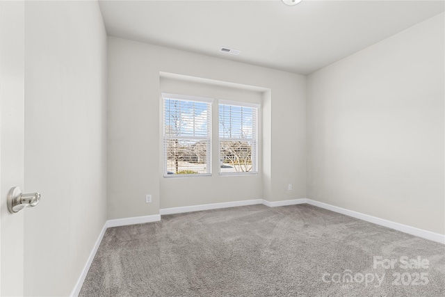 9307 Dufaux Dr, Charlotte, NC 28278 - carpeted spare room with baseboards and visible vents