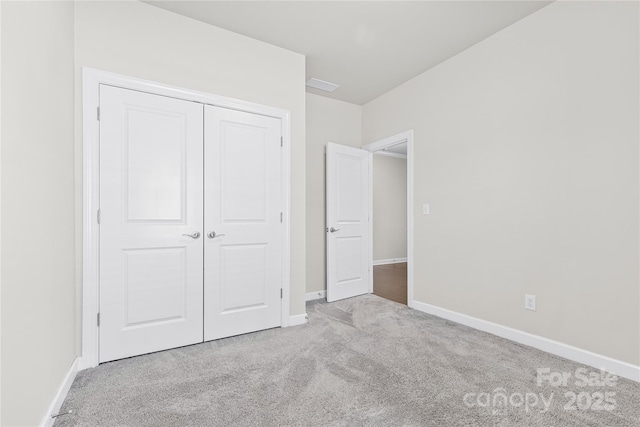 9307 Dufaux Dr, Charlotte, NC 28278 - unfurnished bedroom with carpet floors, baseboards, and a closet