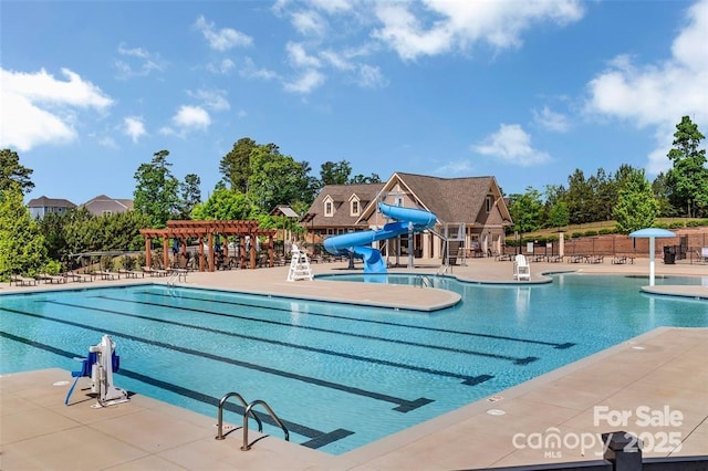 9307 Dufaux Dr, Charlotte, NC 28278 - pool featuring fence, a water slide, a patio, and a pergola