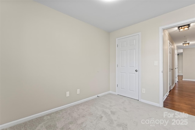 unfurnished bedroom with light colored carpet