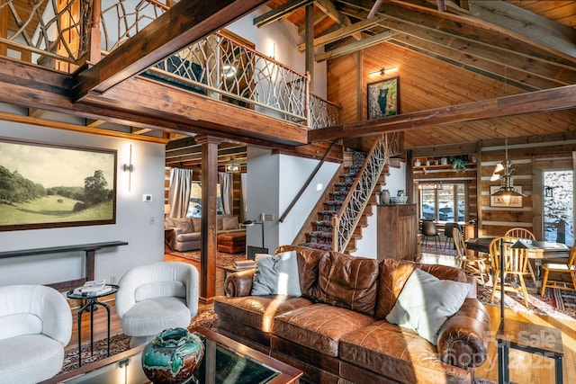 living room with high vaulted ceiling, wood-type flooring, beam ceiling, and wood ceiling