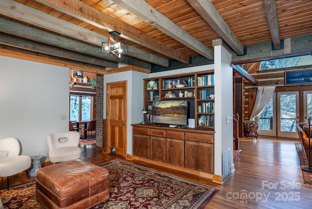 living area featuring french doors, wooden ceiling, hardwood / wood-style floors, and beamed ceiling