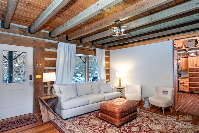 living room with wood ceiling, hardwood / wood-style floors, and beamed ceiling