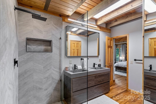 bathroom with vanity, hardwood / wood-style floors, beam ceiling, a shower, and wood ceiling