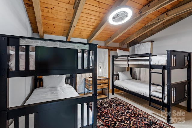 bedroom with lofted ceiling with beams and wood ceiling