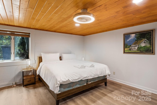 bedroom featuring wood ceiling and hardwood / wood-style flooring