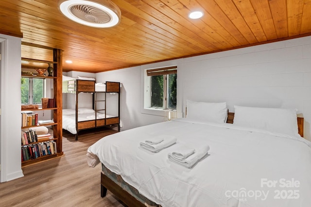 bedroom featuring hardwood / wood-style flooring and wooden ceiling