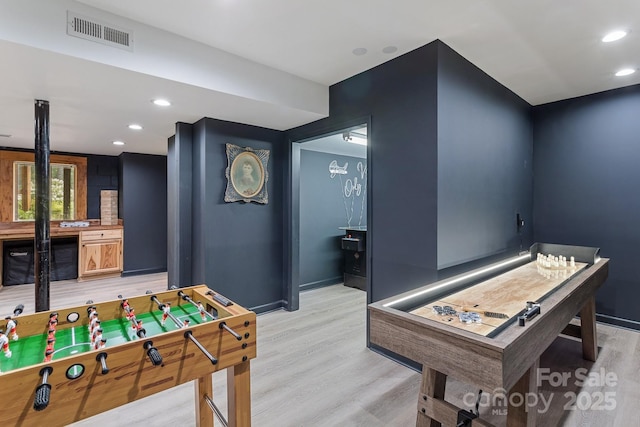 playroom with light hardwood / wood-style flooring