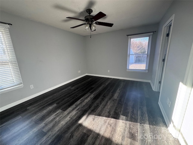 unfurnished room featuring dark hardwood / wood-style flooring and ceiling fan