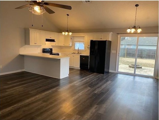 kitchen featuring decorative light fixtures, white cabinetry, black appliances, and kitchen peninsula